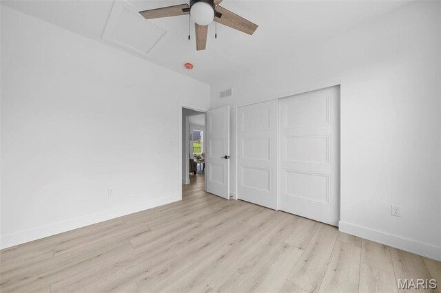 6345 Gibison Rd, Troy, MO 63379 - unfurnished bedroom featuring attic access, light wood finished floors, baseboards, a closet, and ceiling fan