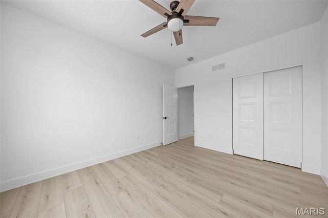 6345 Gibison Rd, Troy, MO 63379 - unfurnished bedroom featuring baseboards, light wood-style floors, a closet, and a ceiling fan