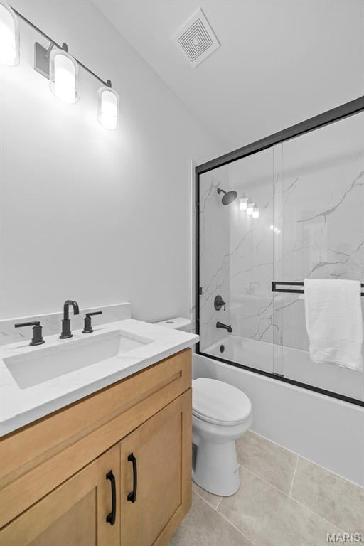 6345 Gibison Rd, Troy, MO 63379 - full bathroom with vanity, shower / bath combination with glass door, toilet, and tile patterned floors