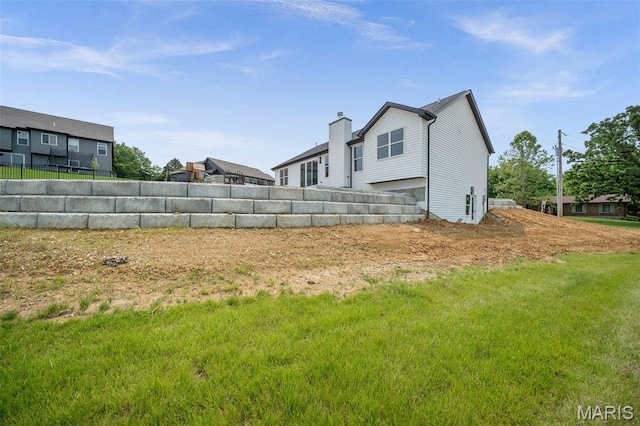 6345 Gibison Rd, Troy, MO 63379 - rear view of property with a chimney