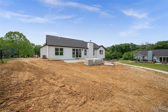 6345 Gibison Rd, Troy, MO 63379 - rear view of property featuring a patio, a chimney, a shingled roof, and central AC unit