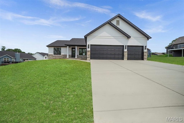 6345 Gibison Rd, Troy, MO 63379 - view of front of home with a garage, concrete driveway, a front yard, and stone siding