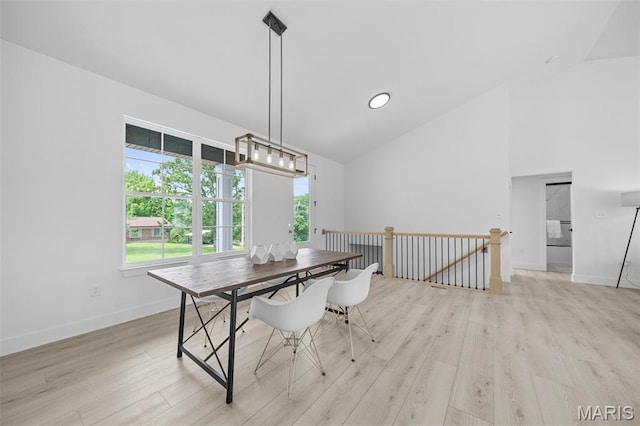 6345 Gibison Rd, Troy, MO 63379 - dining space with light wood-type flooring, healthy amount of natural light, baseboards, and high vaulted ceiling