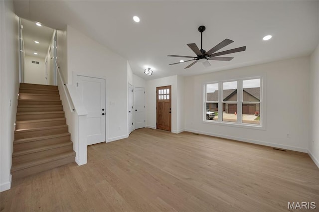 10204 Riehl Farm Dr, Potosi, MO 63664 - unfurnished living room featuring ceiling fan, light wood finished floors, stairway, and recessed lighting