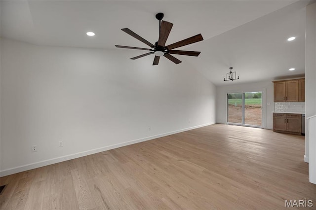 10204 Riehl Farm Dr, Potosi, MO 63664 - unfurnished living room with ceiling fan, light wood-style floors, vaulted ceiling, recessed lighting, and a chandelier