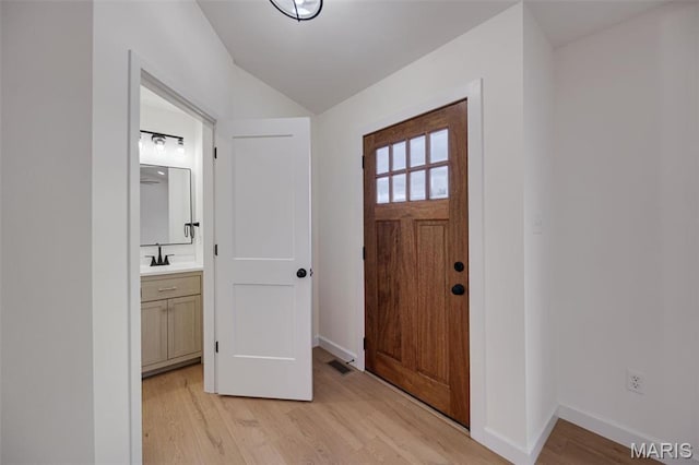 10204 Riehl Farm Dr, Potosi, MO 63664 - entryway with vaulted ceiling and light wood-type flooring