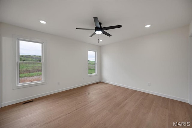 10204 Riehl Farm Dr, Potosi, MO 63664 - spare room featuring light wood-type flooring, a ceiling fan, and recessed lighting