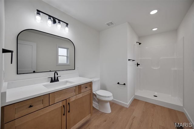 10204 Riehl Farm Dr, Potosi, MO 63664 - bathroom with wood finished floors, a shower, vanity, and recessed lighting