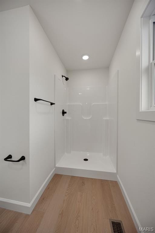 10204 Riehl Farm Dr, Potosi, MO 63664 - bathroom featuring wood finished floors and a shower