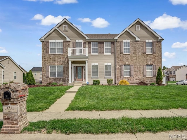 1711 Naughton Way, Swansea, IL 62226 - view of front of house with a front lawn, brick siding, and a balcony