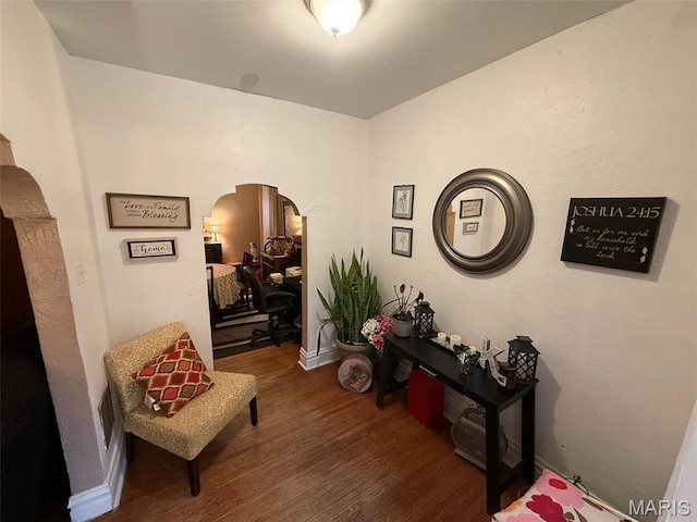 3225 N Taylor Ave, Saint Louis, MO 63115 - sitting room featuring arched walkways and wood finished floors