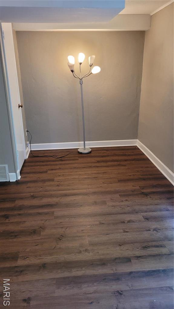 12859 Town And Four Dr Unit 12859, Creve Coeur, MO 63141 - empty room featuring baseboards and dark wood-type flooring