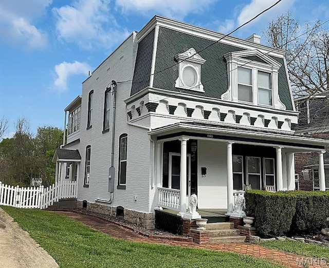 405 Cedar St, Washington, MO 63090 - view of front of house with covered porch and a chimney