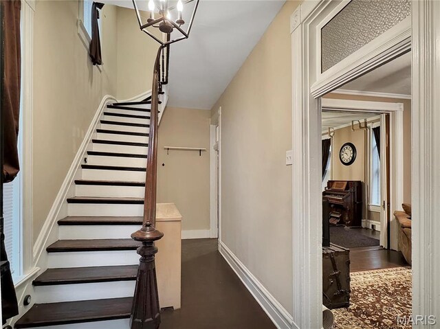 405 Cedar St, Washington, MO 63090 - stairs with a chandelier and baseboards