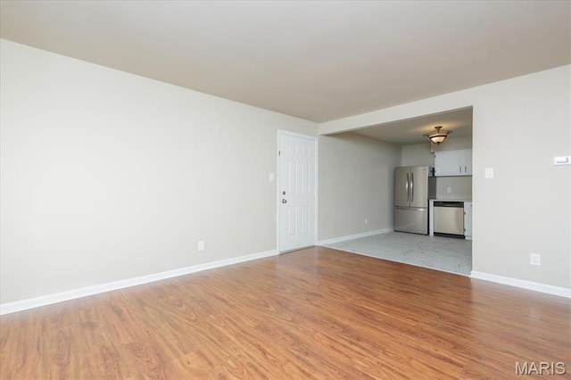 149 Jubilee Hill Dr Unit H, Grover, MO 63040 - unfurnished living room featuring light wood-style floors and baseboards