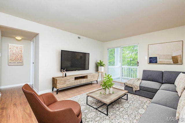 149 Jubilee Hill Dr Unit H, Grover, MO 63040 - living area featuring wood finished floors and baseboards