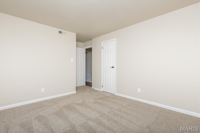 149 Jubilee Hill Dr Unit H, Grover, MO 63040 - spare room featuring baseboards and light colored carpet