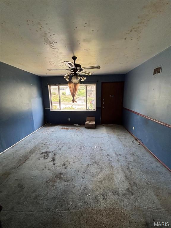4005 Shirley Dr, Saint Louis, MO 63121 - empty room featuring carpet flooring and ceiling fan