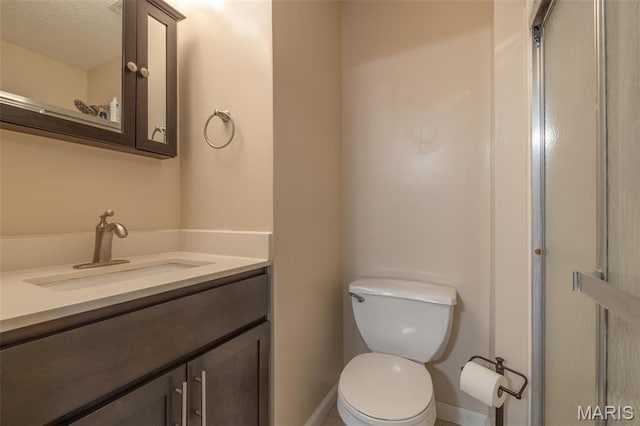 2250 Pinta Dr, Warrenton, MO 63383 - full bathroom with toilet, vanity, and baseboards
