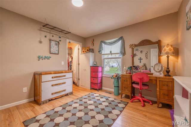2250 Pinta Dr, Warrenton, MO 63383 - bedroom with light wood-style flooring and baseboards