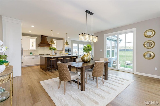 303 Clewer Park Ct, Lake St Louis, MO 63367 - dining space featuring light wood-type flooring, baseboards, and recessed lighting