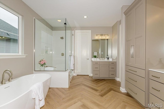 303 Clewer Park Ct, Lake St Louis, MO 63367 - full bath with a shower stall, vanity, a freestanding tub, and recessed lighting