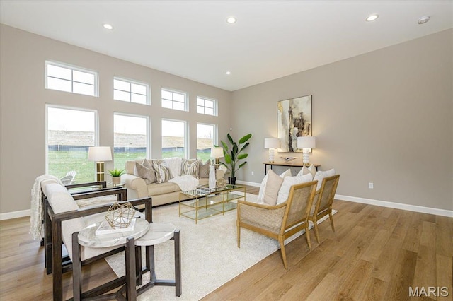 303 Clewer Park Ct, Lake St Louis, MO 63367 - living room featuring light wood-style floors, baseboards, and recessed lighting