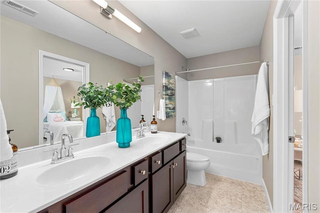 303 Clewer Park Ct, Lake St Louis, MO 63367 - ensuite bathroom featuring bathtub / shower combination, double vanity, and toilet