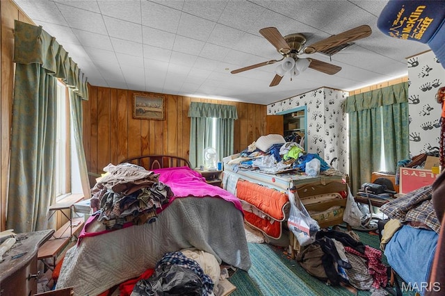 883 Biltmore St, Saint Genevieve, MO 63670 - bedroom with multiple windows, ceiling fan, and wooden walls
