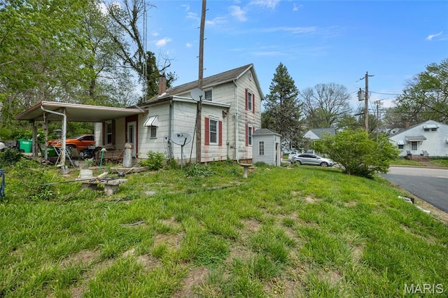 883 Biltmore St, Saint Genevieve, MO 63670 - view of side of property featuring a chimney