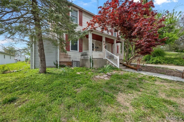 883 Biltmore St, Saint Genevieve, MO 63670 - obstructed view of property featuring a porch