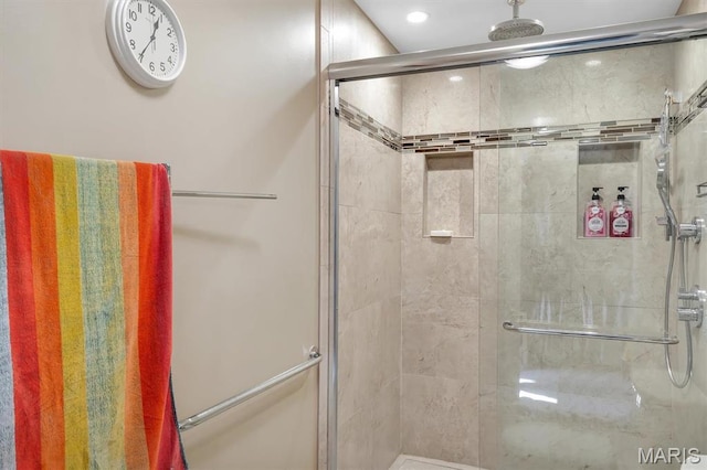 bathroom featuring a stall shower and recessed lighting