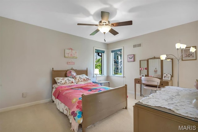 bedroom with light carpet, baseboards, and a ceiling fan
