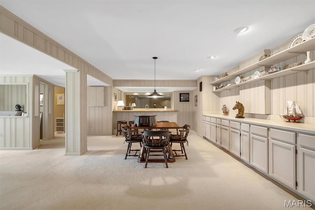 dining room featuring light colored carpet
