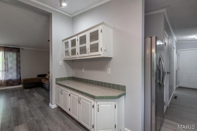 1340 Denmark Rd, Union, MO 63084 - kitchen with stainless steel refrigerator with ice dispenser, ornamental molding, dark wood-type flooring, white cabinetry, and tile counters