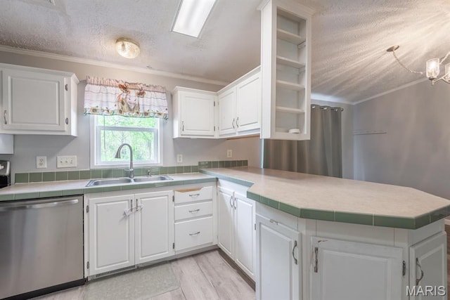 1340 Denmark Rd, Union, MO 63084 - kitchen featuring stainless steel dishwasher, a sink, a peninsula, a textured ceiling, and ornamental molding