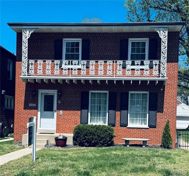 6623 Neosho St, Saint Louis, MO 63109 - view of front of house featuring brick siding, a front yard, and a balcony