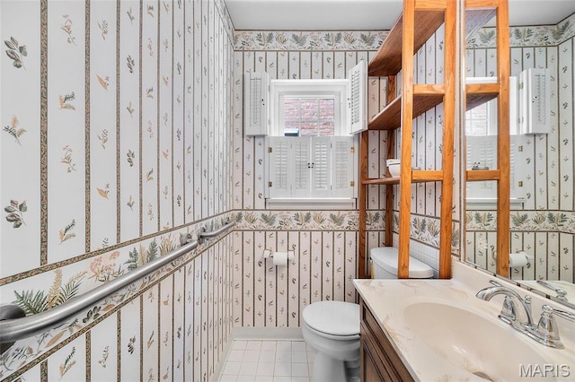 6623 Neosho St, Saint Louis, MO 63109 - bathroom featuring wallpapered walls, toilet, tile patterned flooring, and vanity