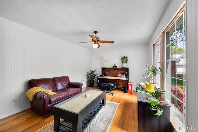 6623 Neosho St, Saint Louis, MO 63109 - living area featuring hardwood / wood-style floors, a ceiling fan, and baseboards