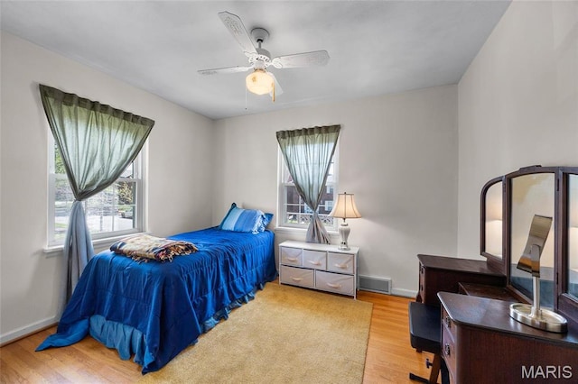 6623 Neosho St, Saint Louis, MO 63109 - bedroom featuring wood finished floors, baseboards, ceiling fan, and a desk