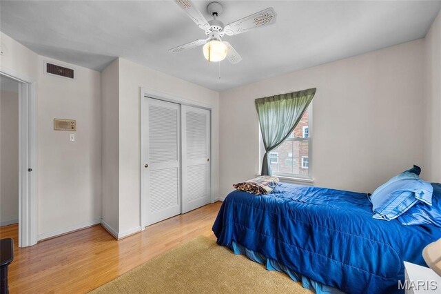 6623 Neosho St, Saint Louis, MO 63109 - bedroom with wood finished floors, a closet, ceiling fan, and baseboards