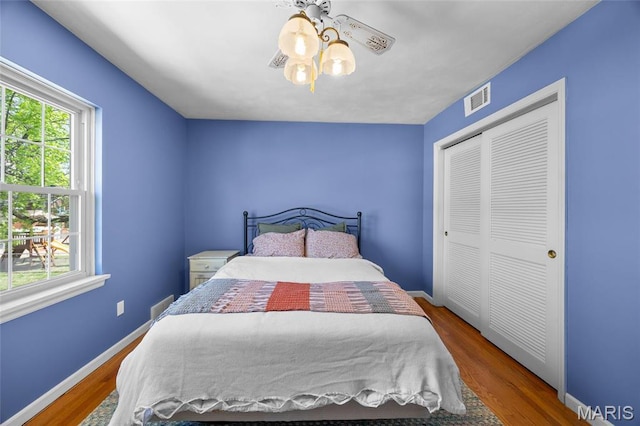 6623 Neosho St, Saint Louis, MO 63109 - bedroom featuring wood finished floors, a closet, and baseboards