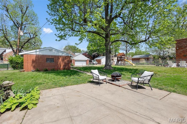 6623 Neosho St, Saint Louis, MO 63109 - view of patio / terrace with an outdoor fire pit and a playground