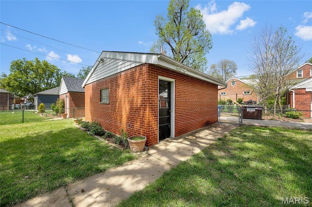 6623 Neosho St, Saint Louis, MO 63109 - view of side of home featuring brick siding and a gate