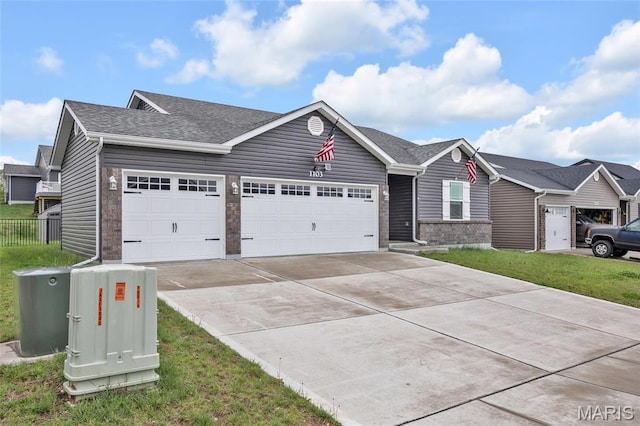 1103 Baseball Dr, Foristell, MO 63348 - ranch-style home featuring an attached garage, concrete driveway, and a shingled roof