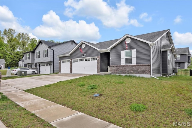 1103 Baseball Dr, Foristell, MO 63348 - view of front of property with concrete driveway, brick siding, a garage, and a front yard