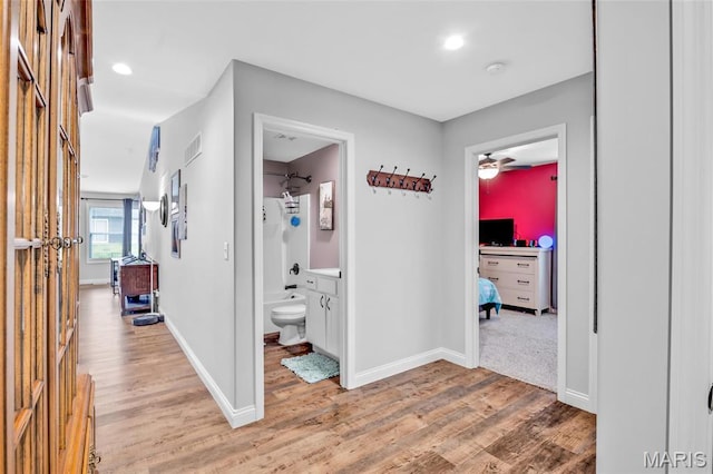1103 Baseball Dr, Foristell, MO 63348 - hall featuring light wood-style floors and baseboards