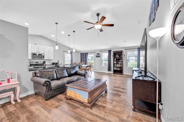 1103 Baseball Dr, Foristell, MO 63348 - living area featuring lofted ceiling, ceiling fan, wood finished floors, baseboards, and recessed lighting