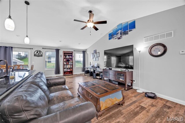 1103 Baseball Dr, Foristell, MO 63348 - living area with wood finished floors, ceiling fan, lofted ceiling, and baseboards