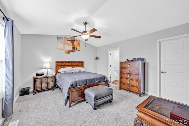 1103 Baseball Dr, Foristell, MO 63348 - carpeted bedroom featuring vaulted ceiling, baseboards, ceiling fan, and ensuite bathroom